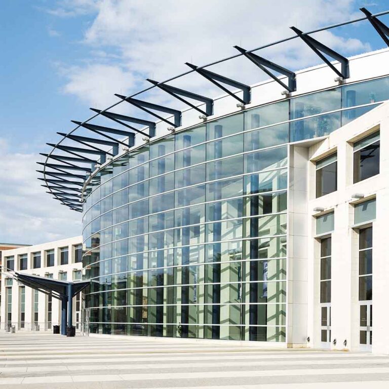 glass facade on a commercial building with curved exterior