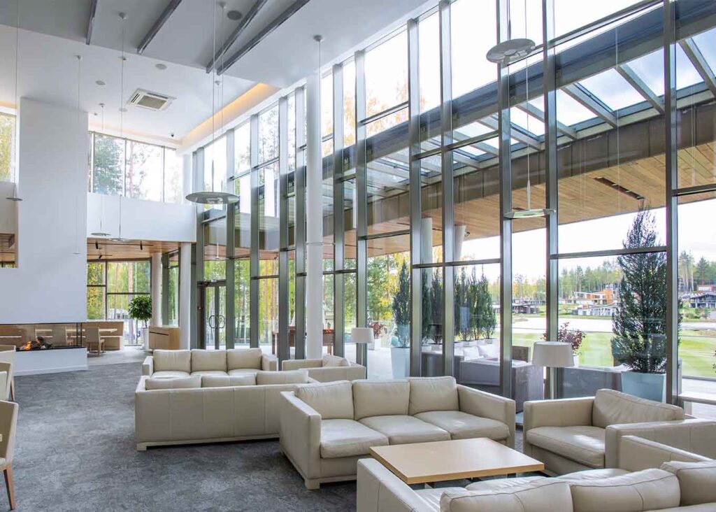 modern glass building interior with couches