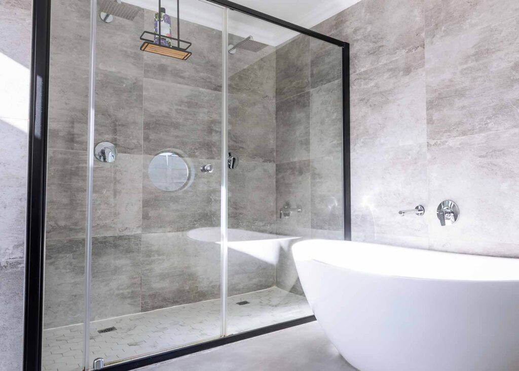 modern glass shower enclosure in bathroom
